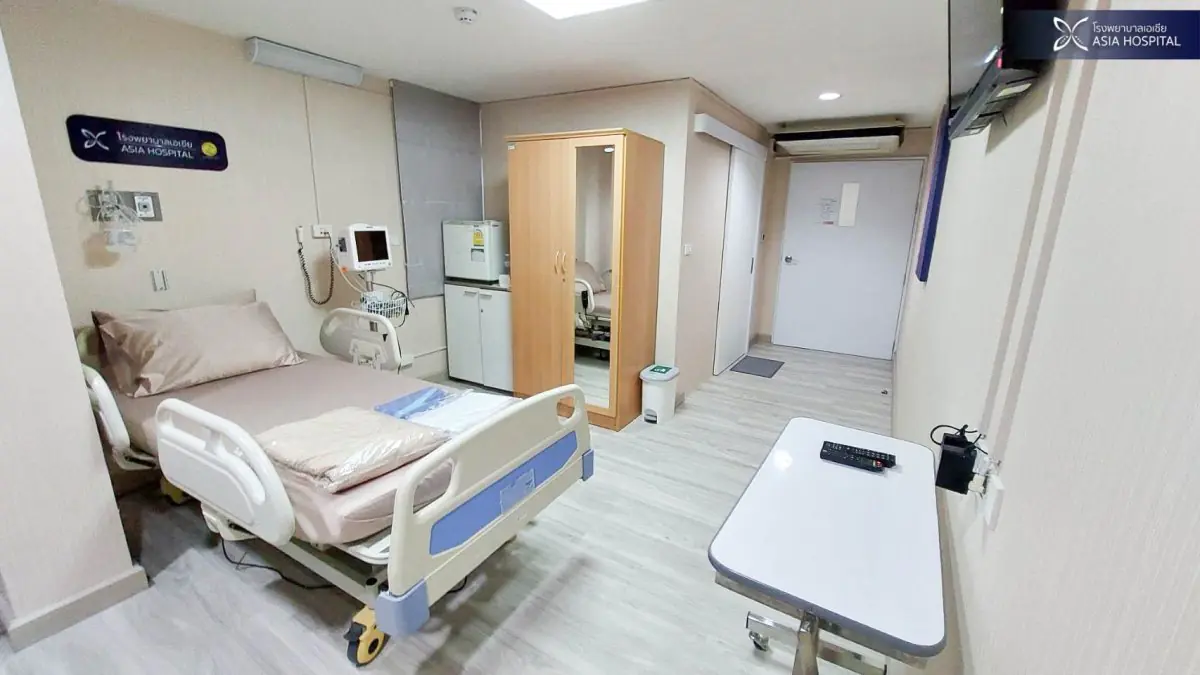 Patient room at Asia Cosmetic Hospital with modern medical equipment and amenities