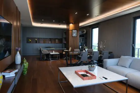 Modern executive office at Soraca Med clinic with meeting area and wood decor