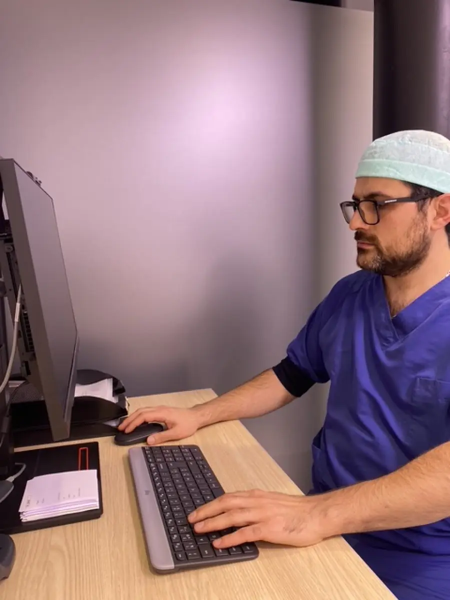Medical staff at Zarina Clinic working at computer in consultation room