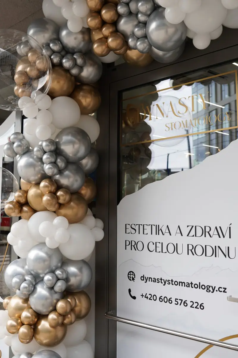 Entrance of Dynasty Stomatology clinic in Prague decorated with festive balloons