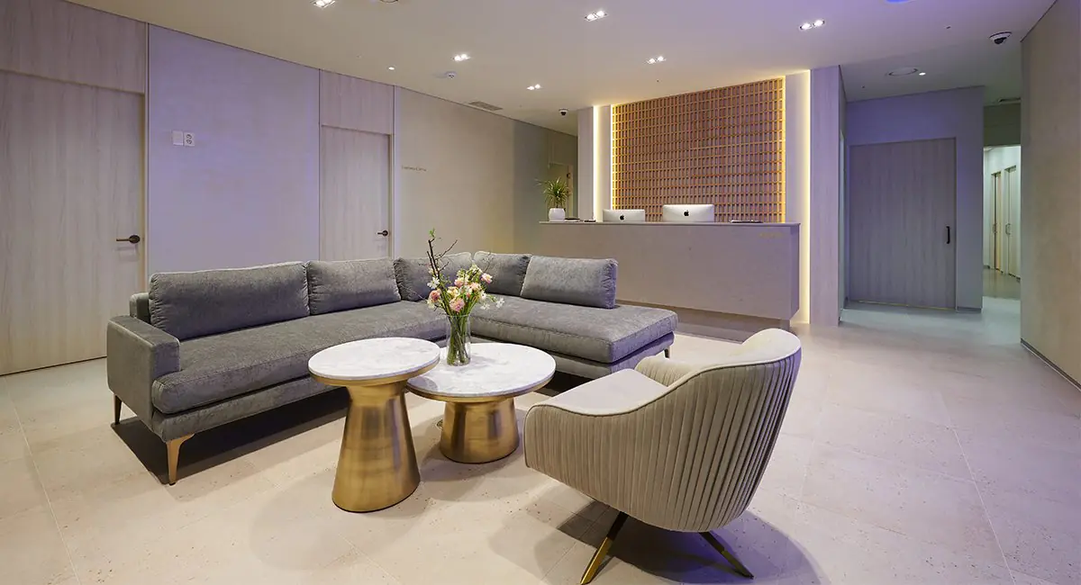 Reception and waiting area at Trinity Women's Clinic with modern lounge seating