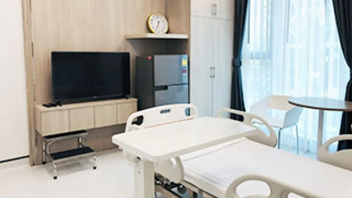 Patient room at Bangkok Dental International Hospital with modern amenities