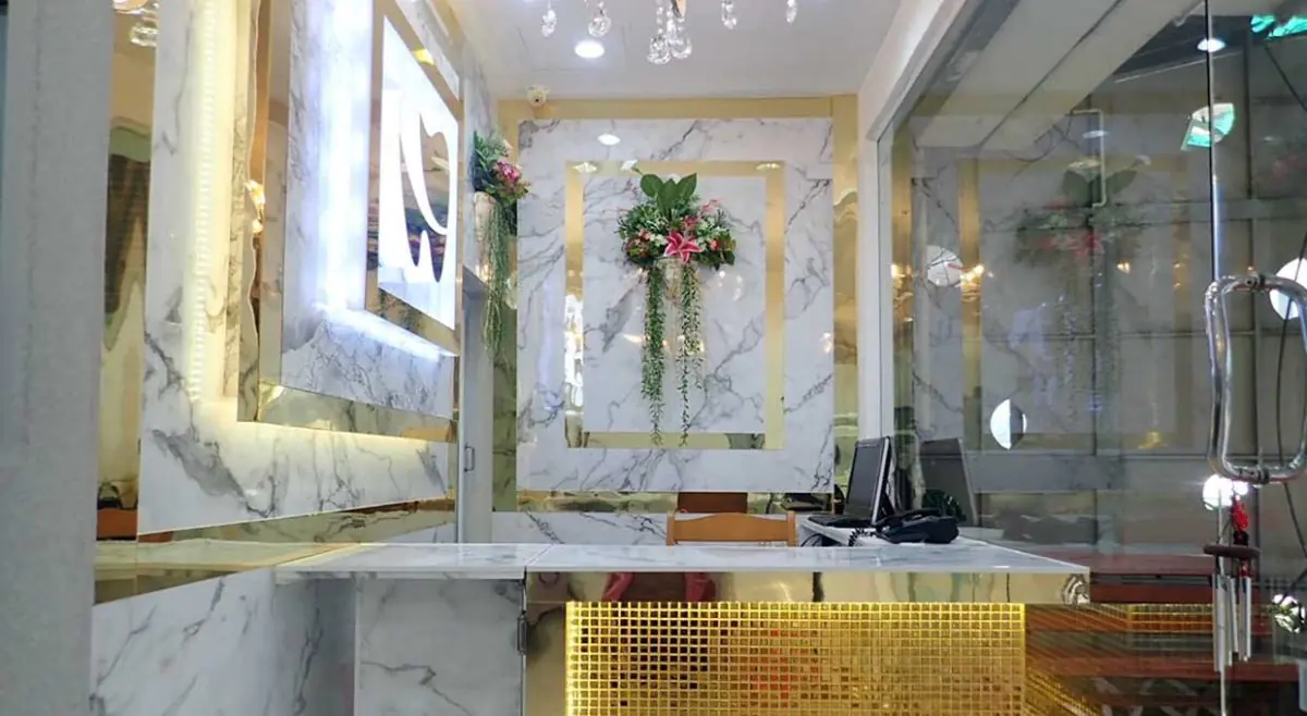 Reception area at Pattaya Smile Dental Clinic with marble decor and modern design