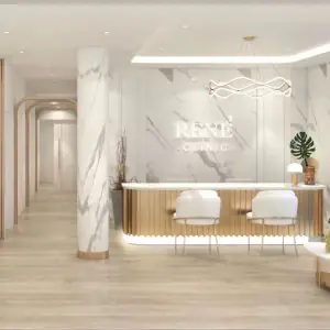 منطقة الاستقبال في René Clinic بتصميم داخلي حديث من الرخام والخشب