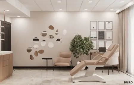Sala de consulta moderna en la clínica Volodymyr Sazhiyenko con sillón médico y certificados