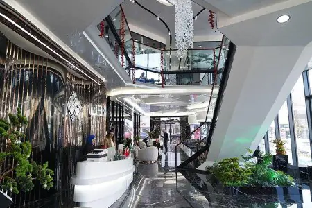 Modern reception area at Lema Dental Clinic with stylish interior and seating