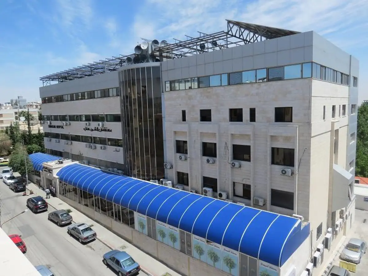 Legacy Dental Clinics building exterior in Amman, modern multi-story medical facility