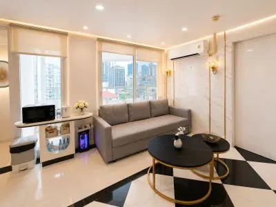 Modern patient lounge at ID Clinic Bangkok with city view and comfortable seating