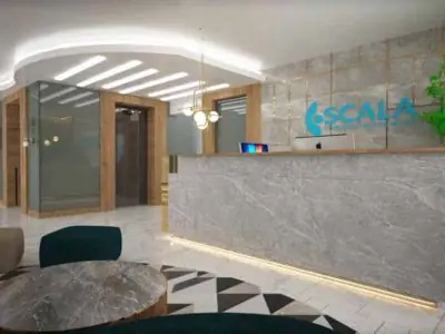منطقة الاستقبال في عيادة سكالا مع مكتب رخام حديث وديكور أنيق