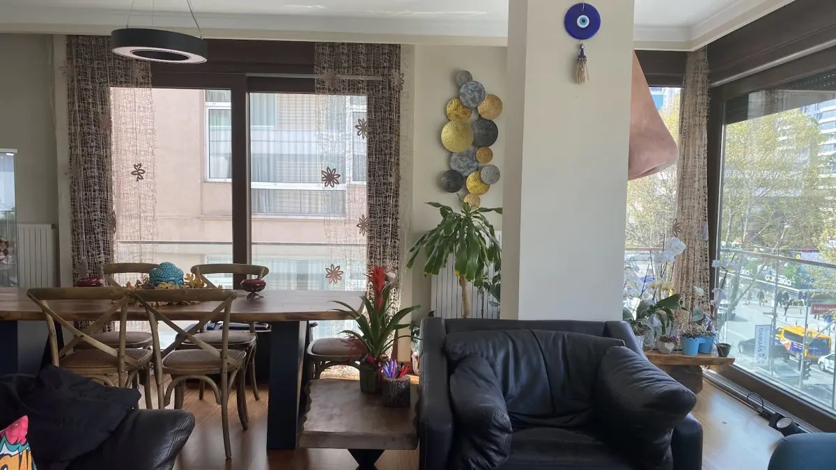Waiting area at ORHAN ALAN CLINIC with modern decor and large windows in Turkey