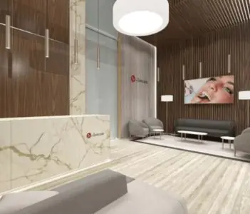 Recepción y sala de espera en Kliniki Dr Sobczak con diseño moderno de clínica dental