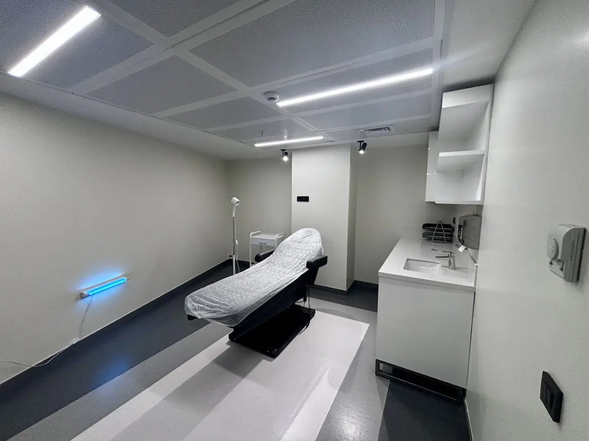 Modern treatment room at DALI HAIR CLINIC with medical bed and equipment