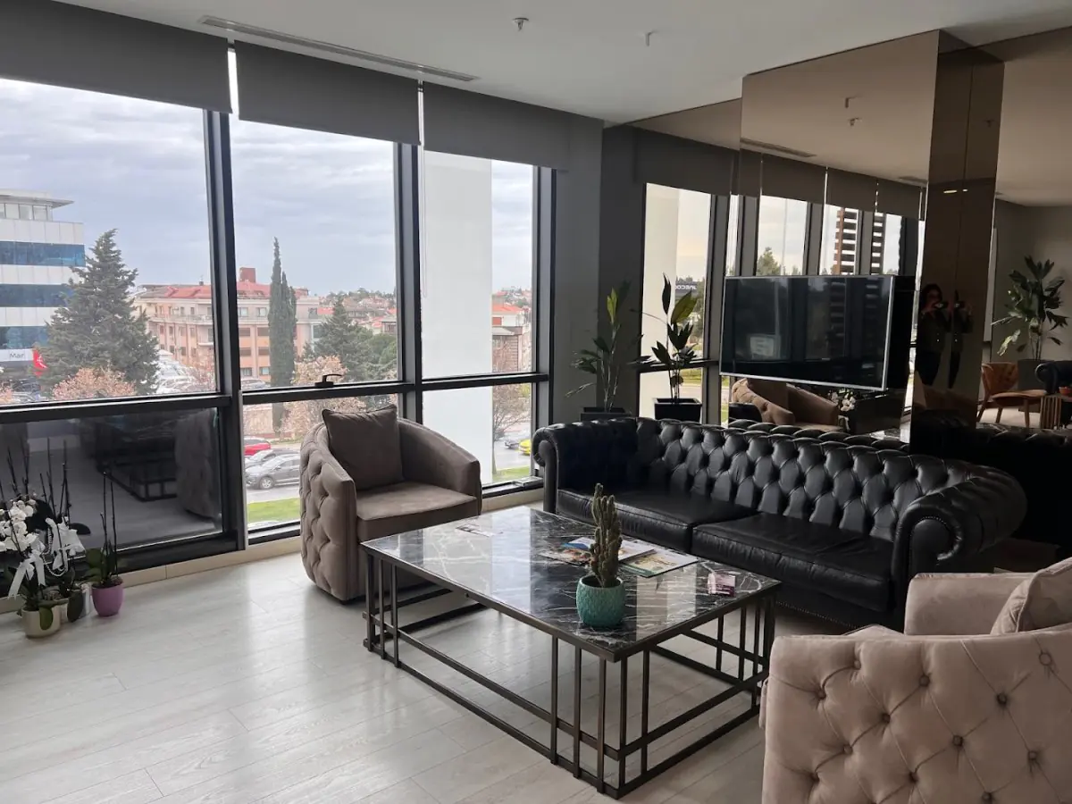 Waiting area at Dr. Berra Önsoy Clinic, modern lounge with city view in Turkey
