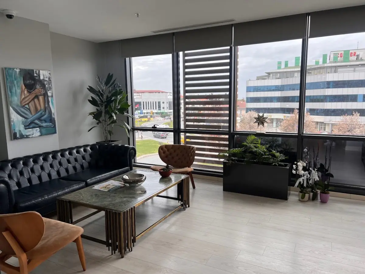 Modern waiting room at Dr. Berra Önsoy Clinic in Turkey with city view