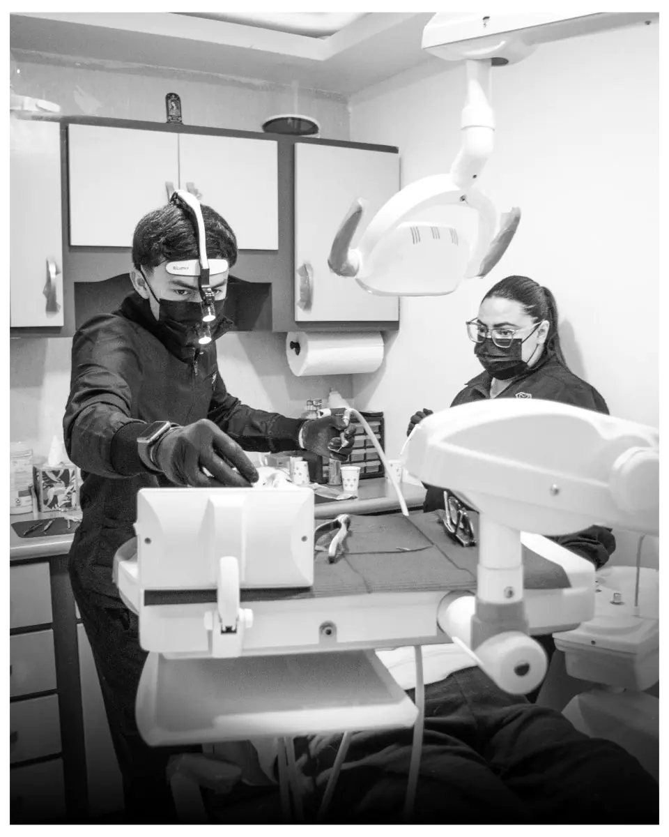 Dental procedure room at Unik Specialized Dentistry with staff and modern equipment