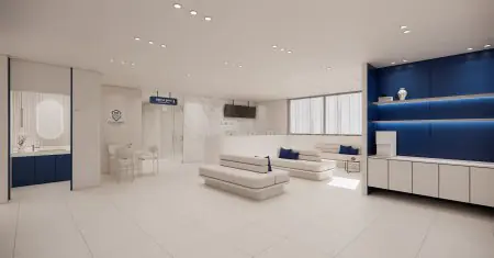 منطقة الاستقبال والانتظار في عيادة Guardians Dental بتصميم داخلي عصري أزرق وأبيض