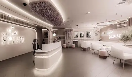 Área de recepción en The Cosmo Clinic con decoración moderna y sala de espera