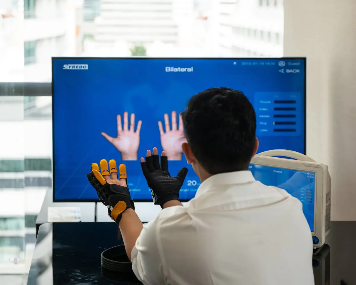 Hand rehabilitation therapy with robotic gloves at PYONG Rehabilitation Group clinic