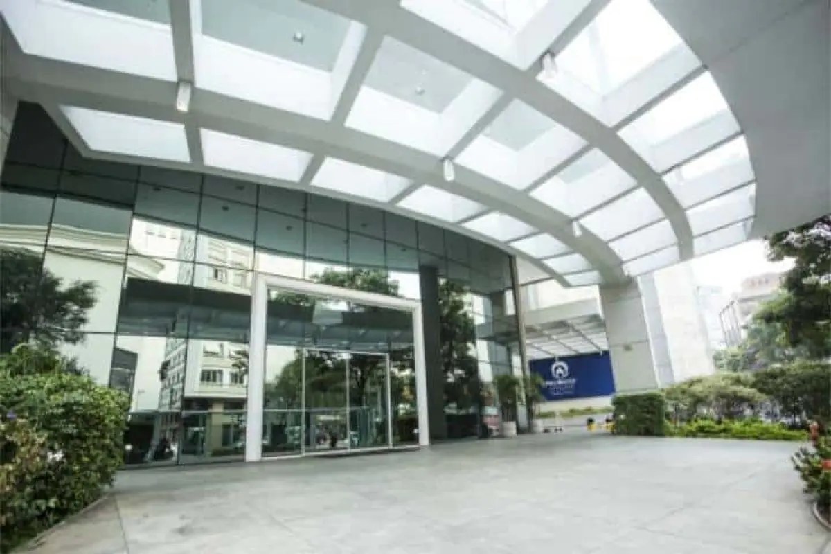 Modern glass facade of ImplArt clinic entrance in São Paulo, Brazil