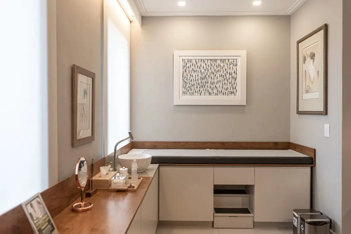 Modern consultation room at clinic Riccardi with exam table and medical sink