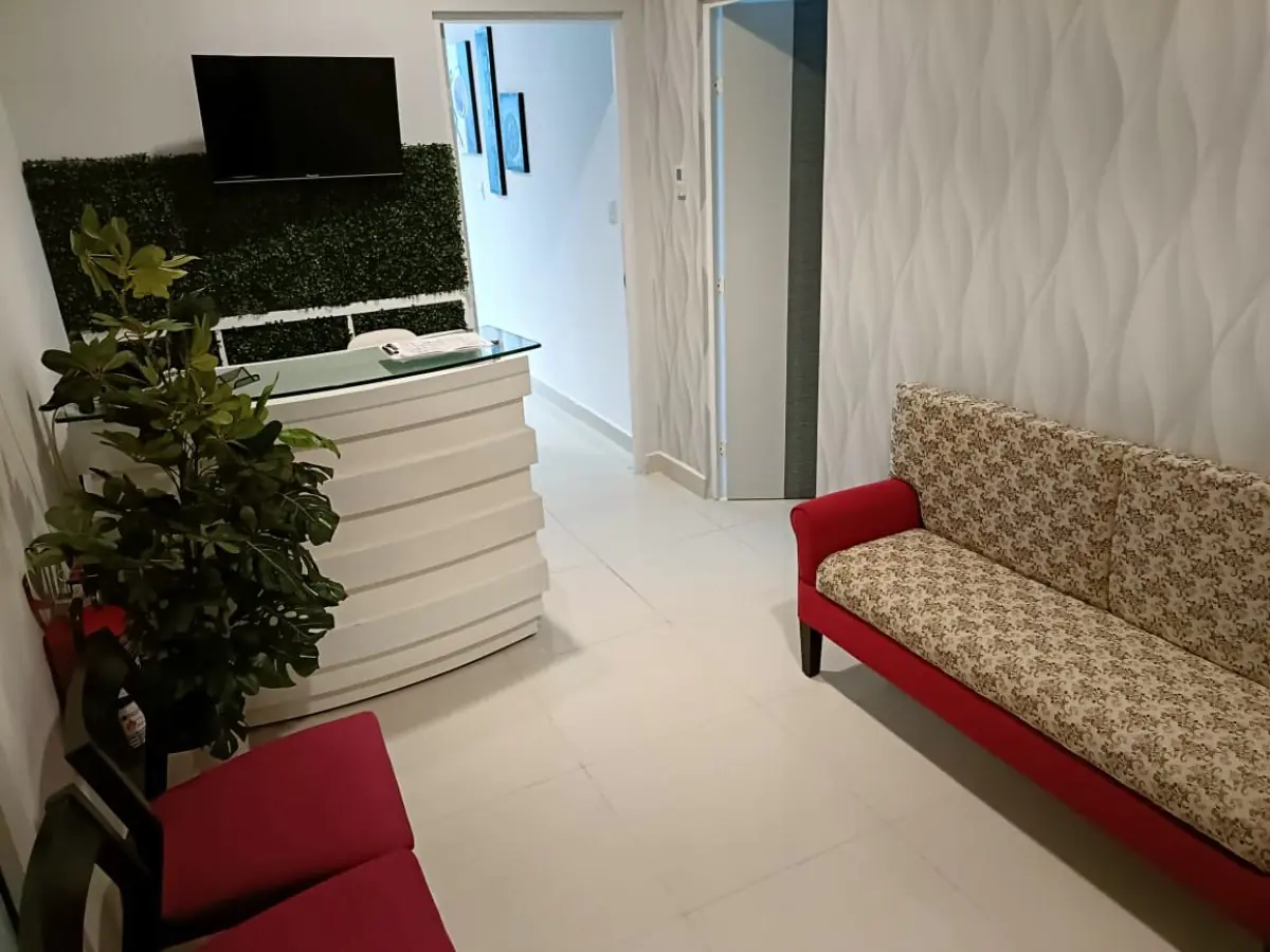 Reception and waiting area at Dr. Karaly Castillo clinic with modern decor