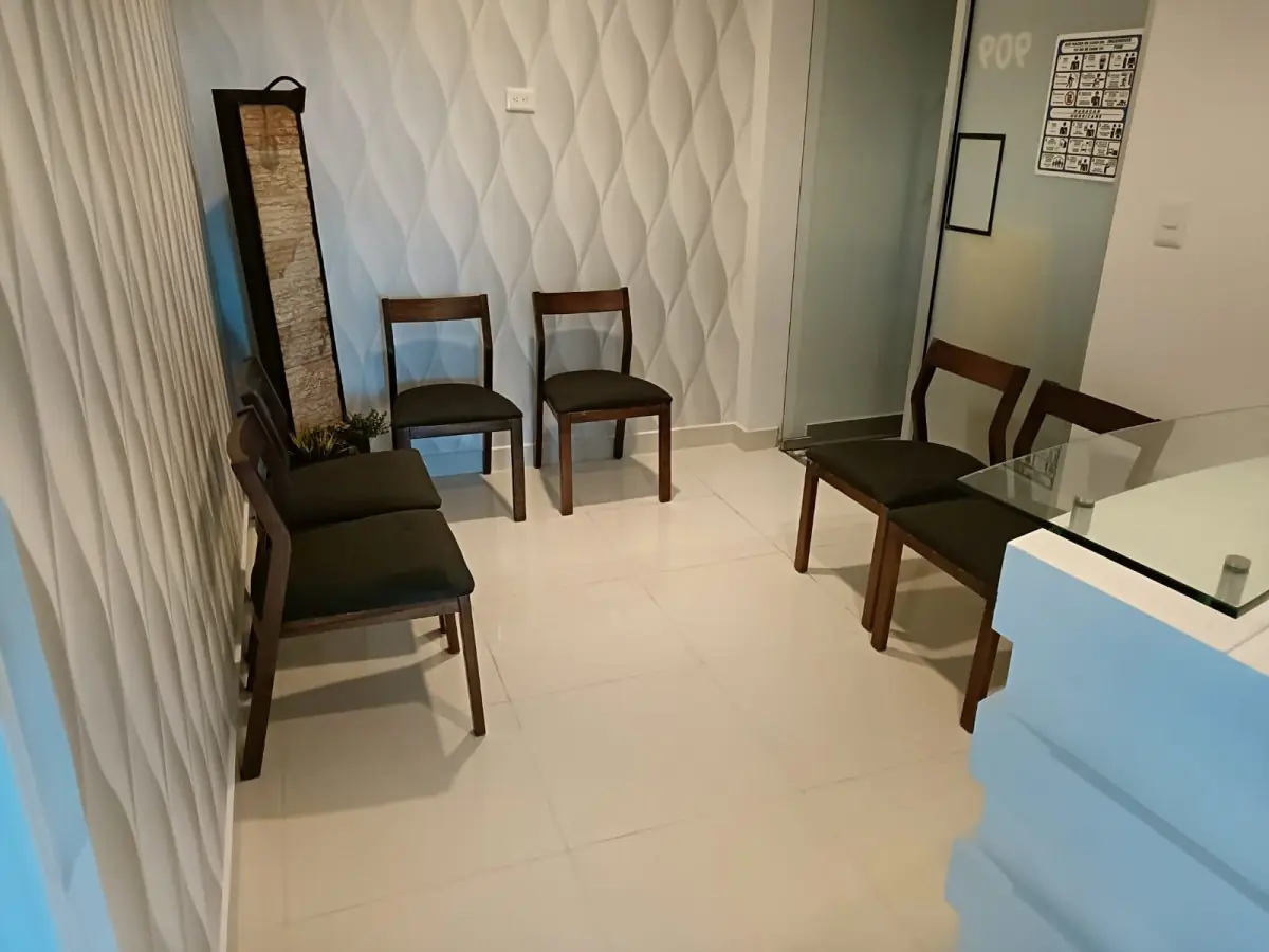 Waiting room at Dr. Karaly Castillo clinic with modern decor and seating