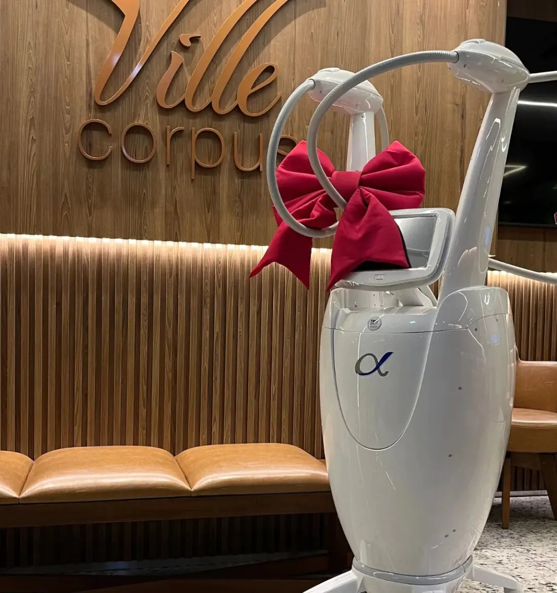 Modern medical equipment with red bow at Ville Corpus clinic reception