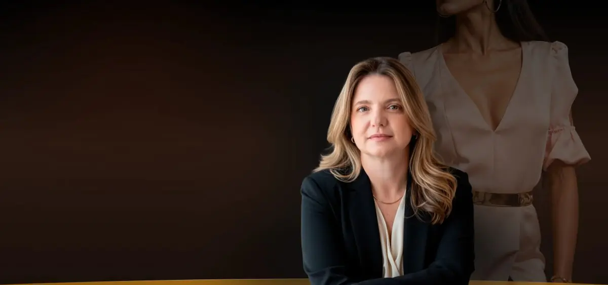 Anne Groth Show Clinic staff member in professional attire, clinic branding background