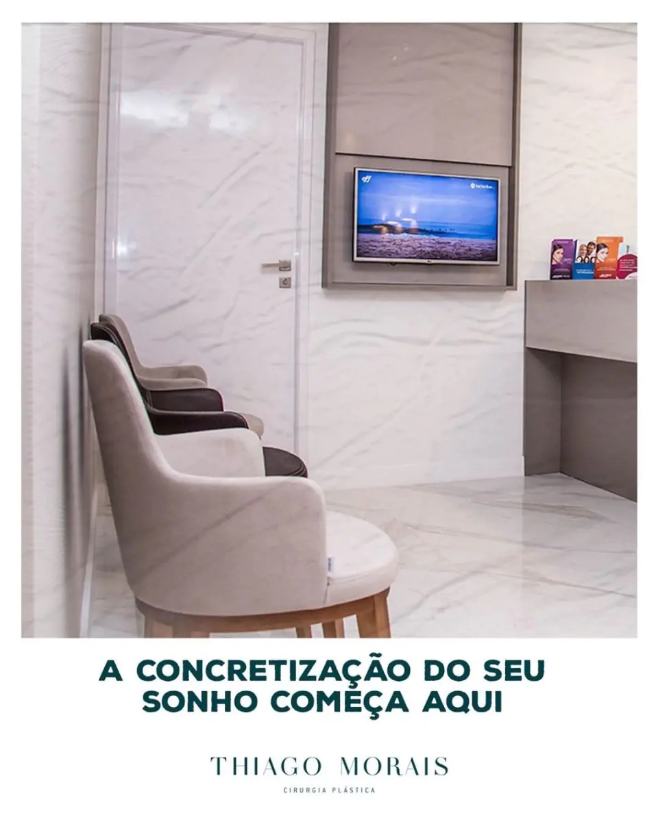Waiting room at Thiago Morais clinic with modern chairs and TV, Brazil