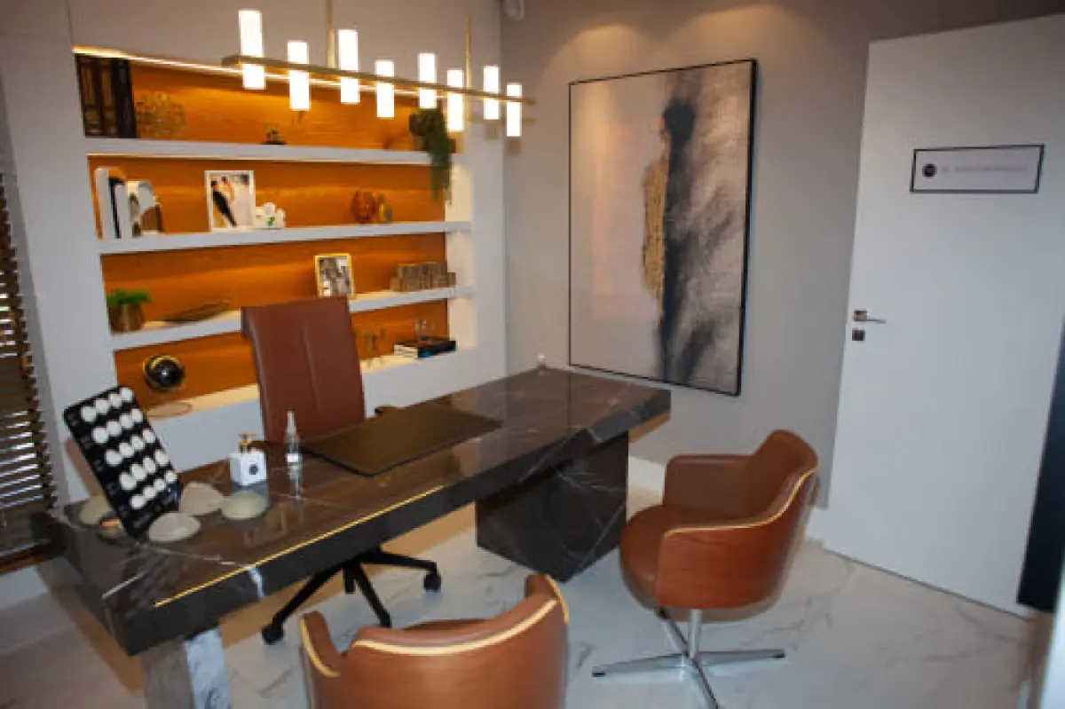 Consultation office at Dr. Mario Bongiolo clinic with modern decor and implants display