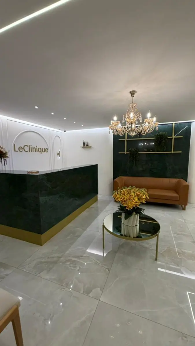 Reception area at Le Clinique with modern decor and comfortable seating