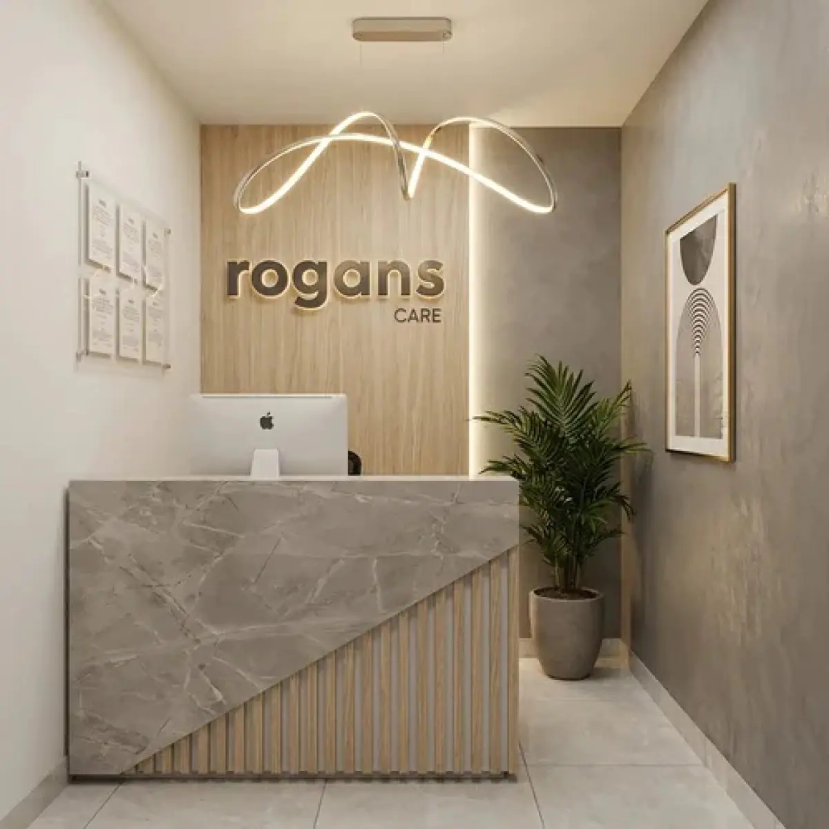 Reception desk at Rogans Care clinic with modern decor and computer
