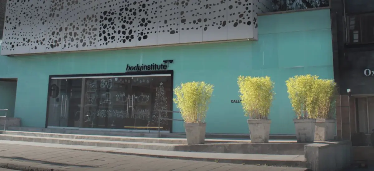 Clinic facade of Body Institute with modern exterior and decorative plants