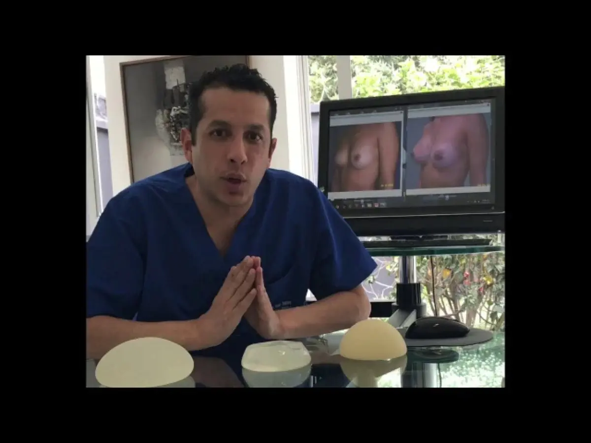 Consultation room at Ivan Santos Plastic Surgery with breast implants and before-after photos