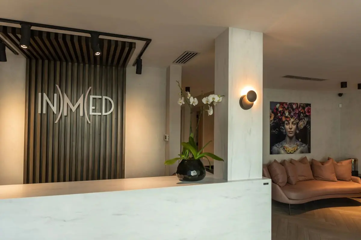 Reception area at INMED Clinic with modern decor and patient lounge