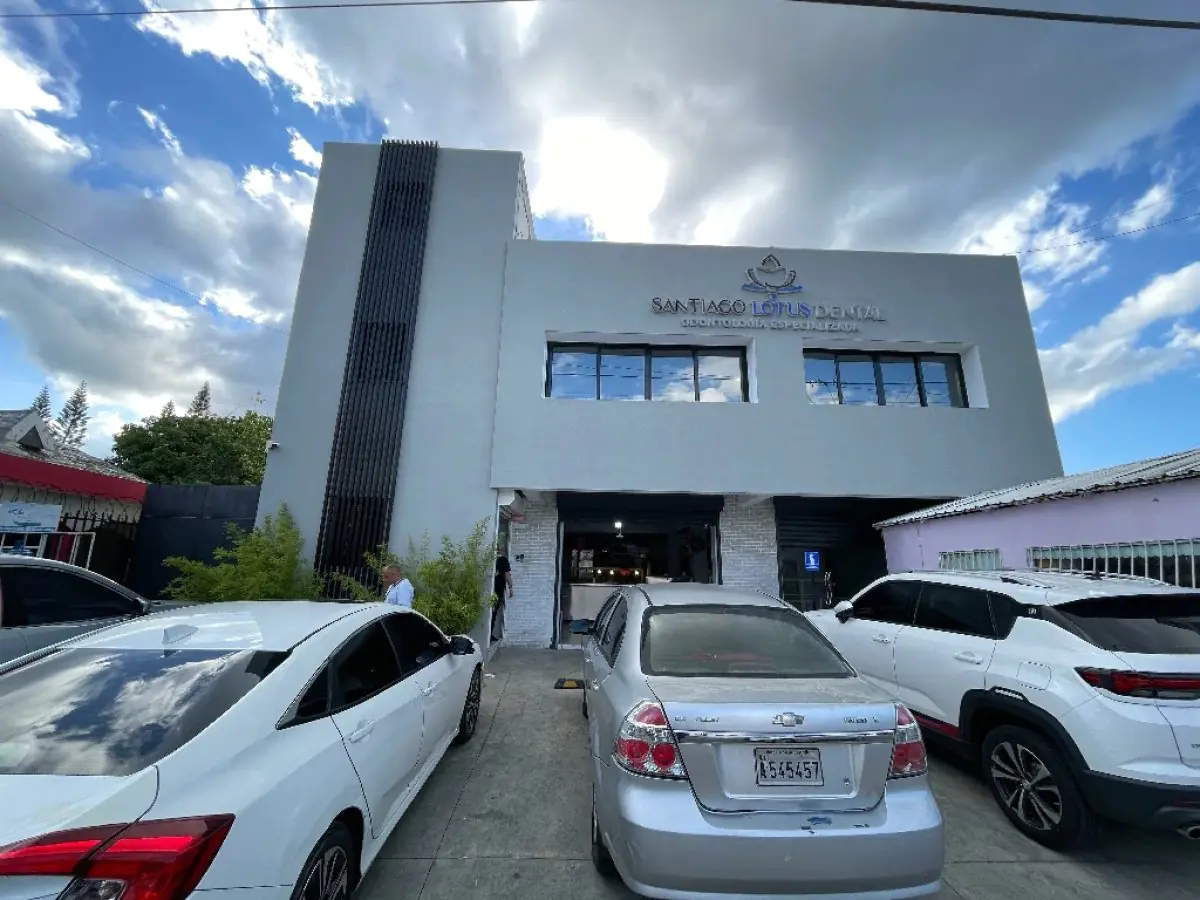 Exterior view of Santiago Lotus Dental clinic building with parking area