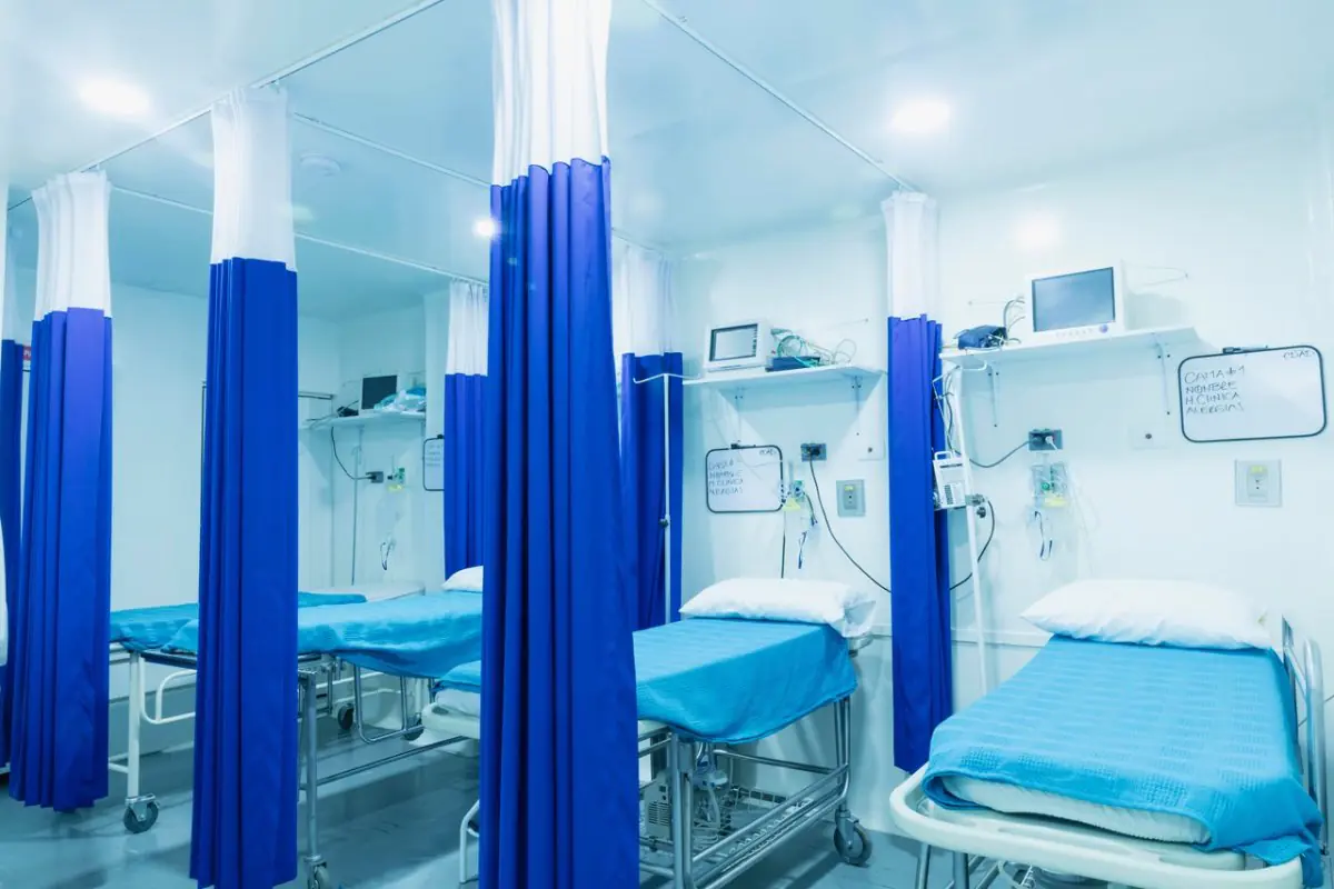 Patient recovery room at Colombian Clinic of Plastic Surgery with medical monitors