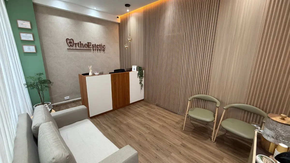 Reception area at Orthoestetic Studio with modern decor and patient seating