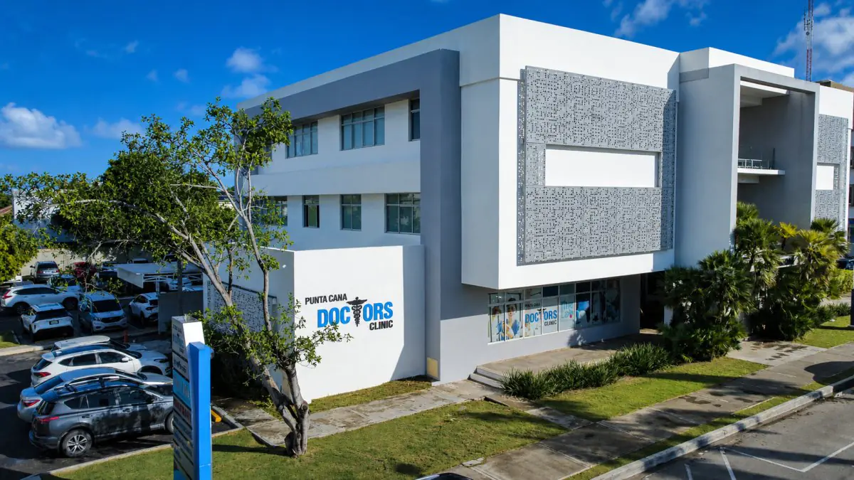 Modern exterior of Punta Cana Doctors Clinic with parking area in Dominican Republic