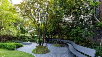 Sanpiti Rehabilitation Center garden area with walking path and benches for patient relaxation